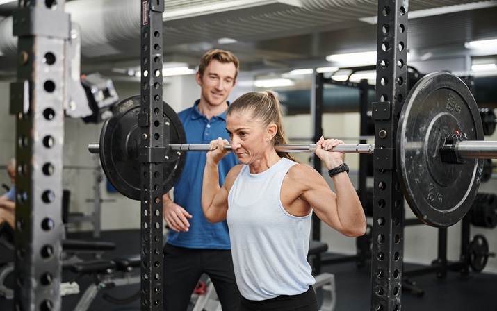 Personal trainer with client