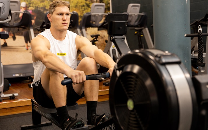 Gym Workout A photo of a gym attendant performing the Seated Row Workout