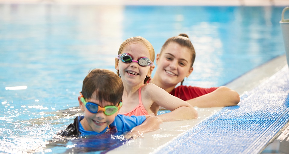 HBF Stadium swim instructor with happy students