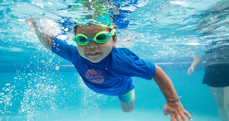 Boy learning to swim underwater at HBF Stadium