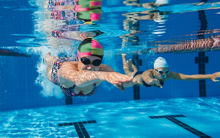 Two women swimming underwater
