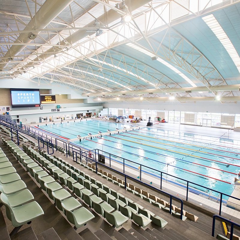 A photo taken from the stands of the indoor poo; area, including the 50m pool