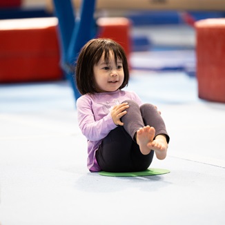Photo, child doing activity on floor mats at the Gymnastics Training Centre, Perth HPC